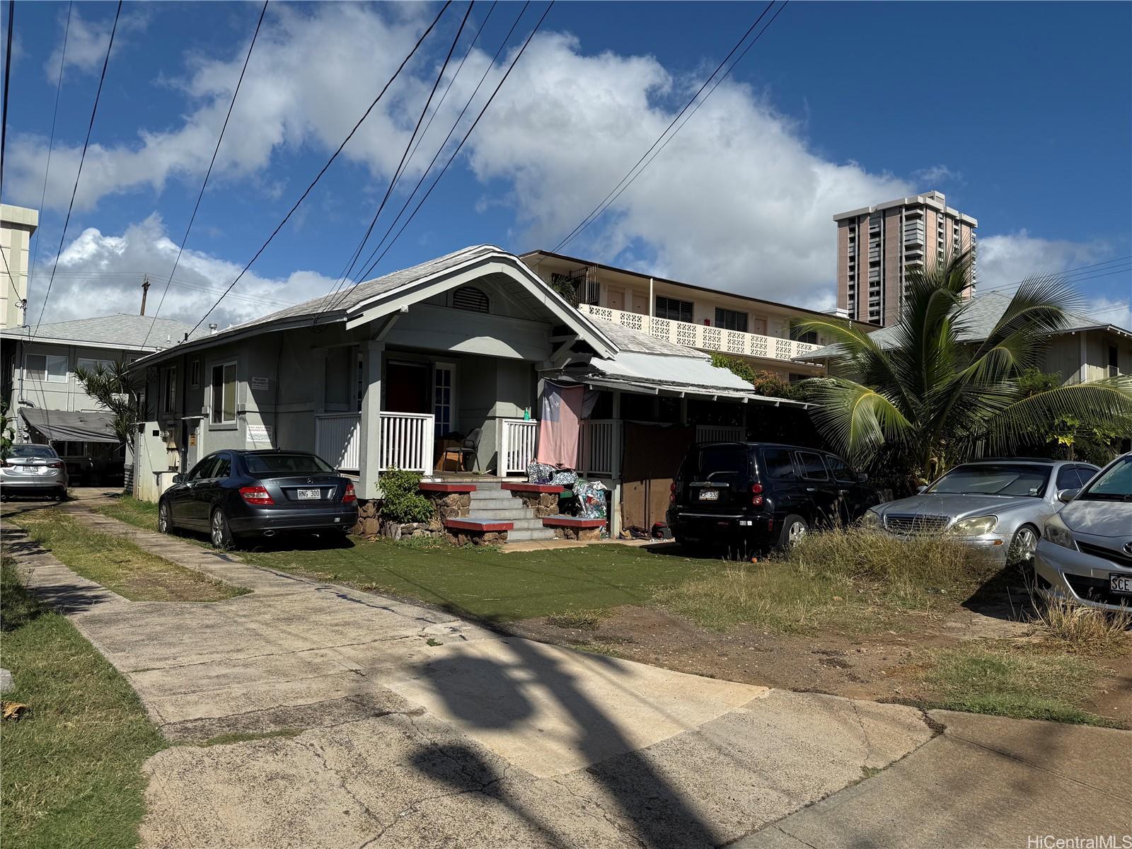 a view of a car is parked in front of a building