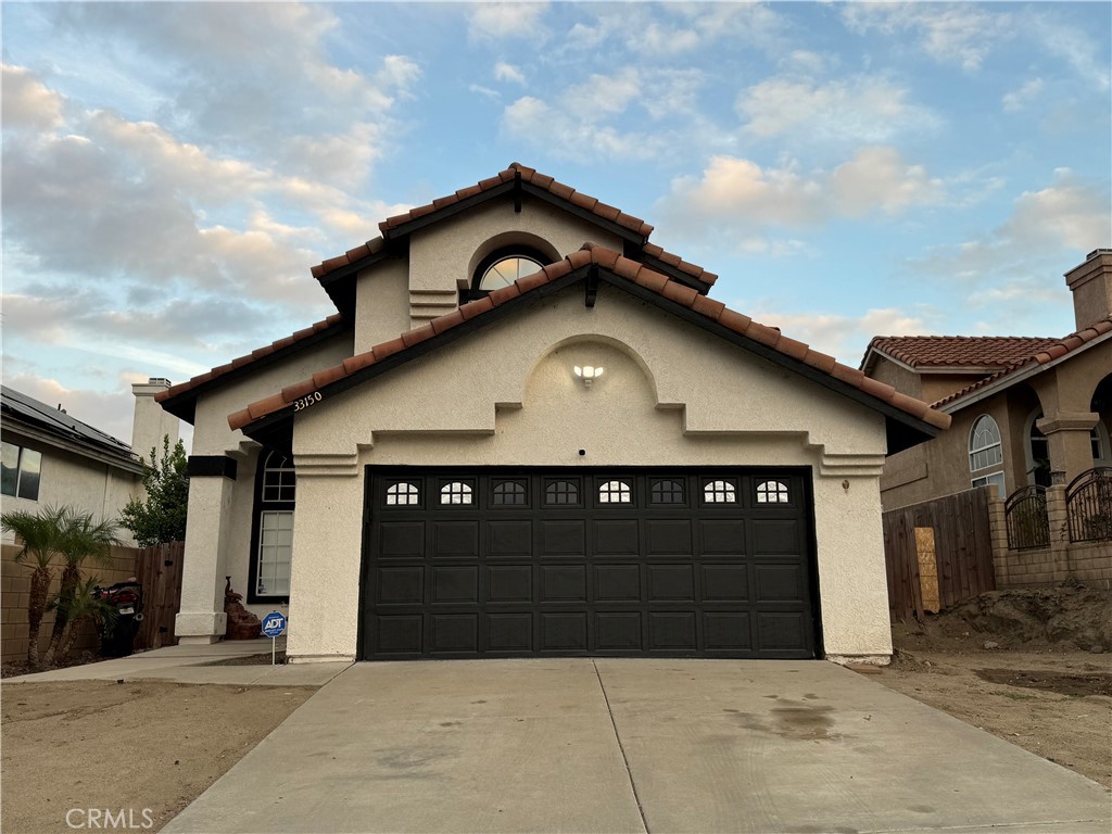 a front view of a house with garage and garage