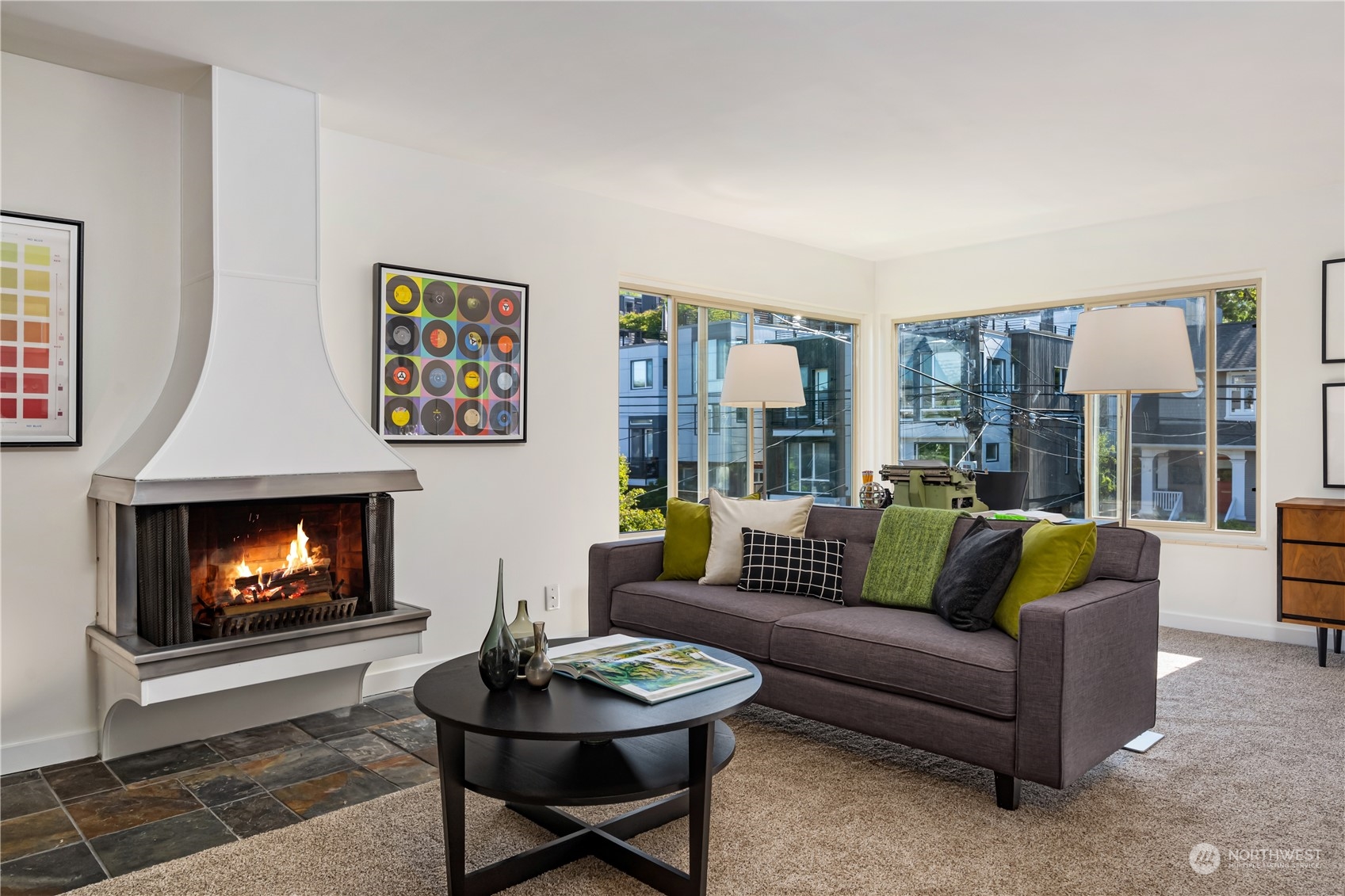 a living room with furniture and a fireplace