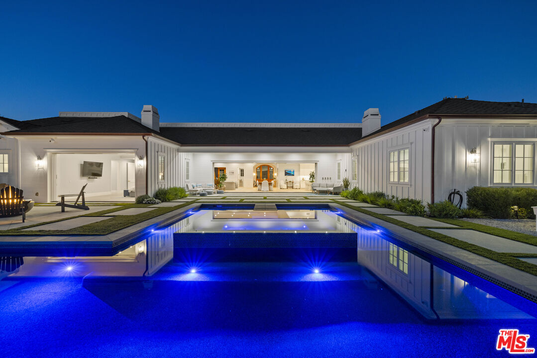 a view of swimming pool with outdoor seating