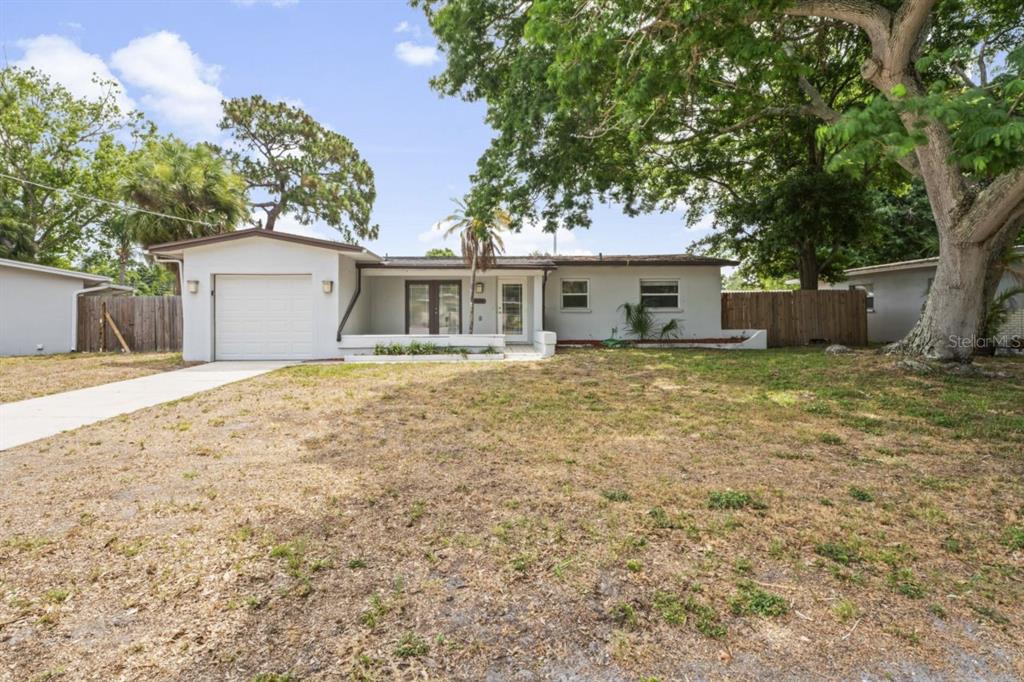 front view of a house with a yard