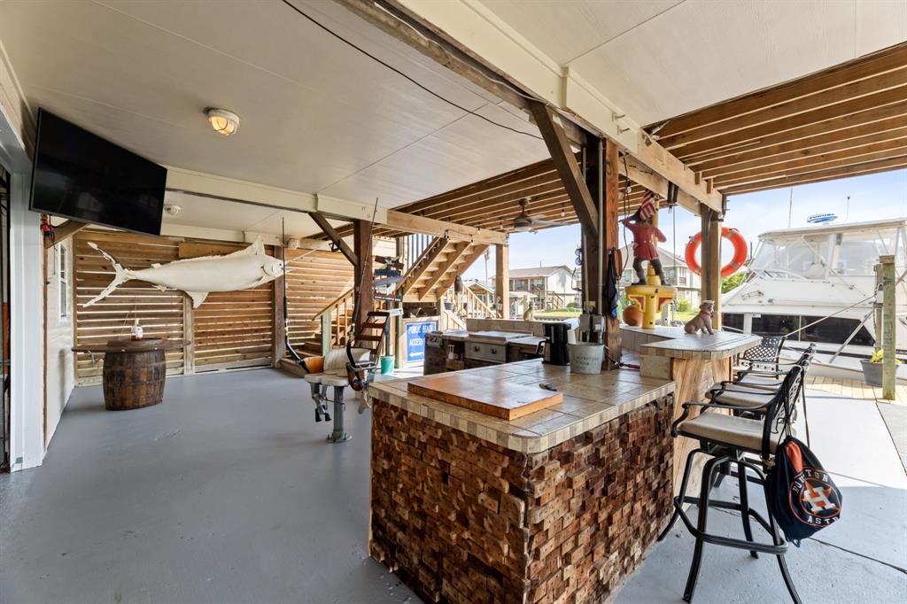 a kitchen with stainless steel appliances granite countertop a sink and a refrigerator