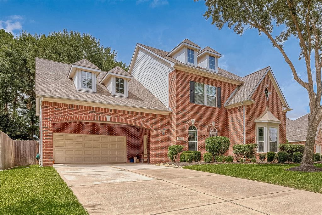 Beautiful Village Builders home with The Sisley elevation! Recent Roof and charming architectural details create a welcoming curb appeal!