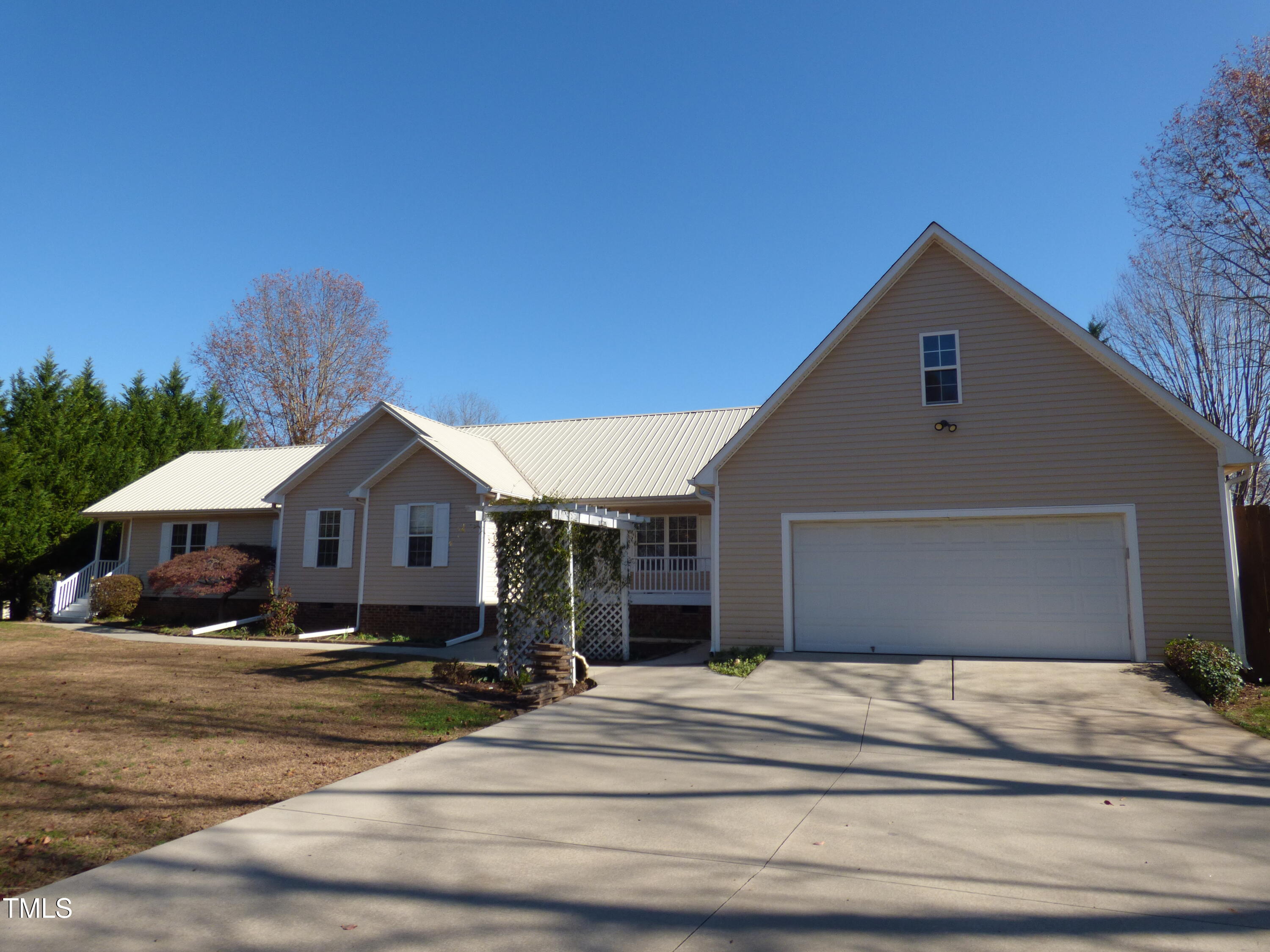 front of garage and home