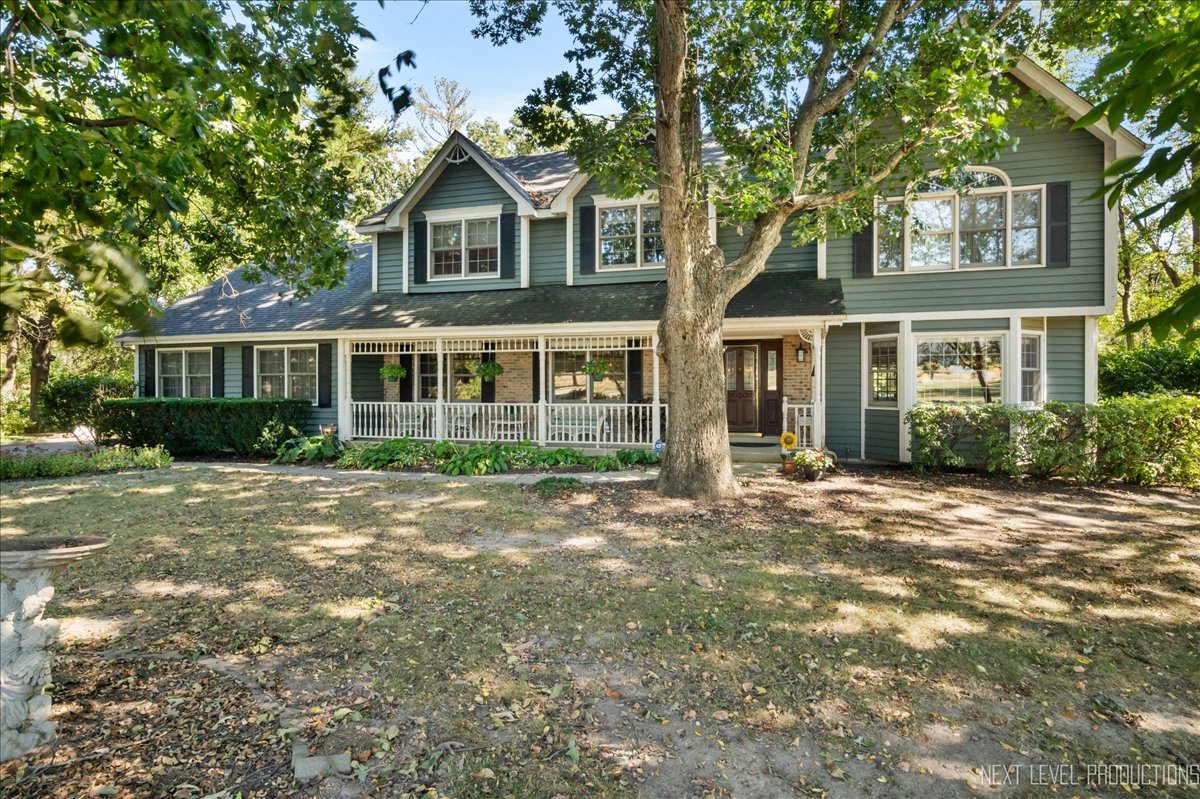 front view of a house with a garden