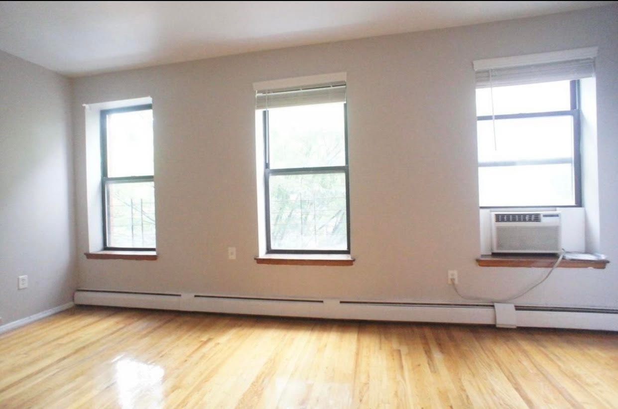 a view of an empty room and window