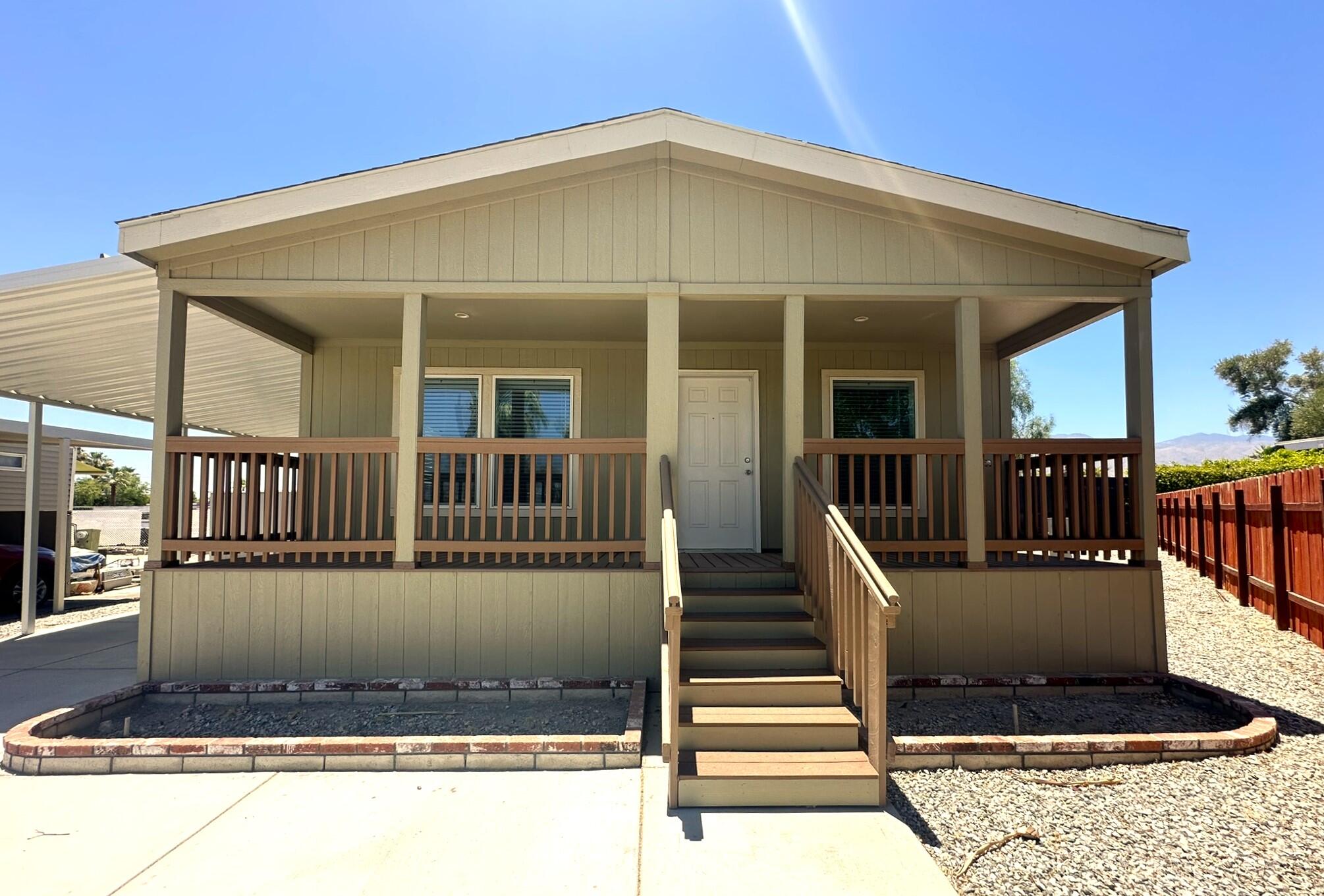 a front view of a house with a porch