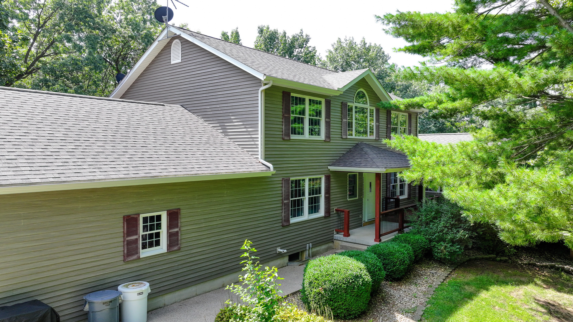 a front view of a house with garden