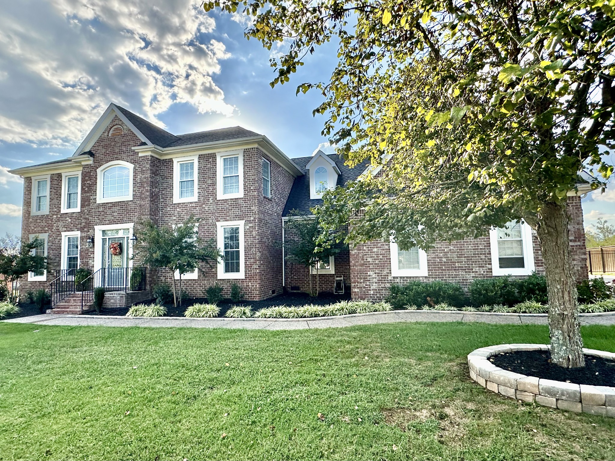 a front view of a house with a yard