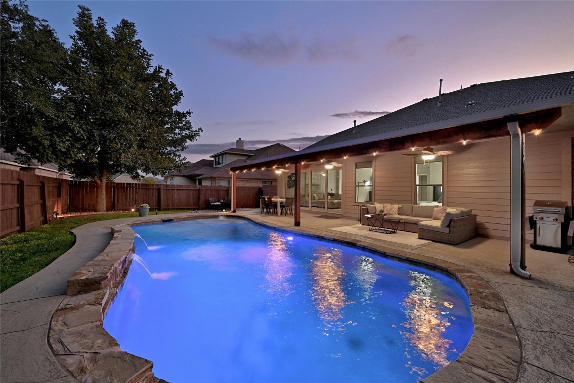 a view of swimming pool with outdoor seating