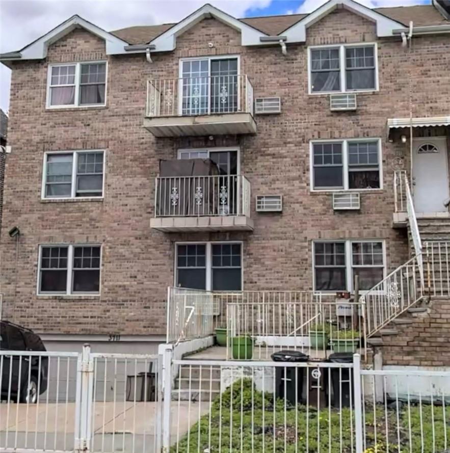 a front view of a house with a fence