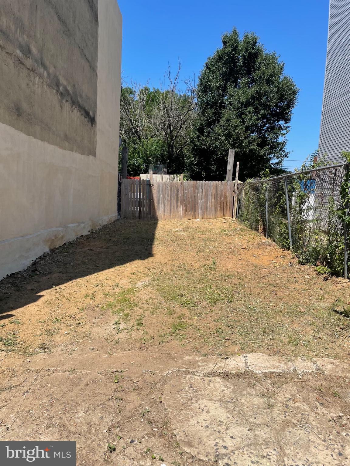 a view of a backyard of the house