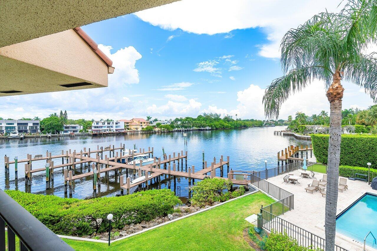 a view of a lake with couches and city view