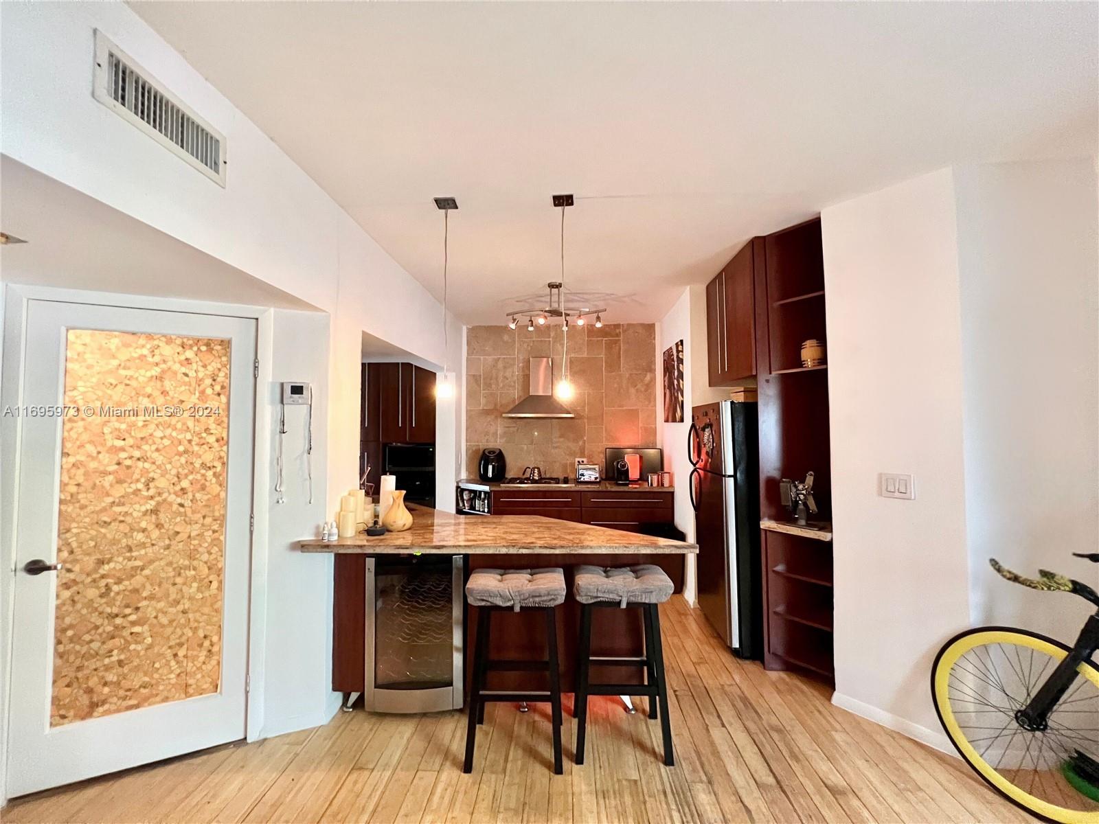 a kitchen with a table and chairs in it