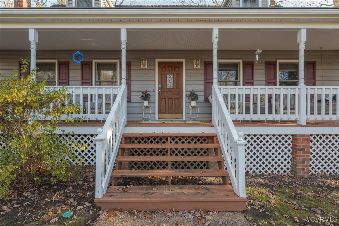 Property entrance with covered porch