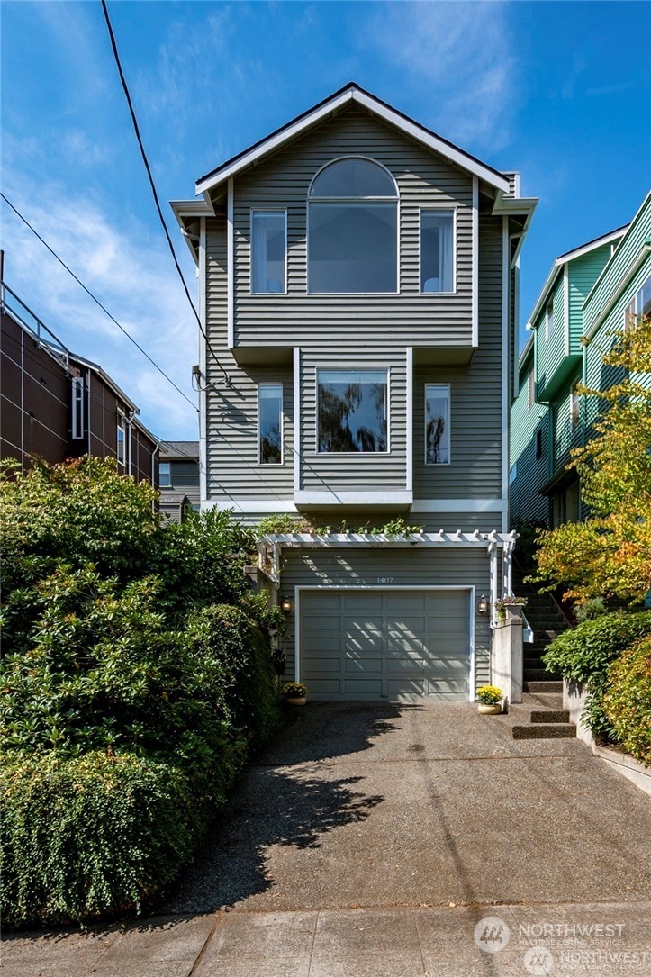 a front view of a house with a garage