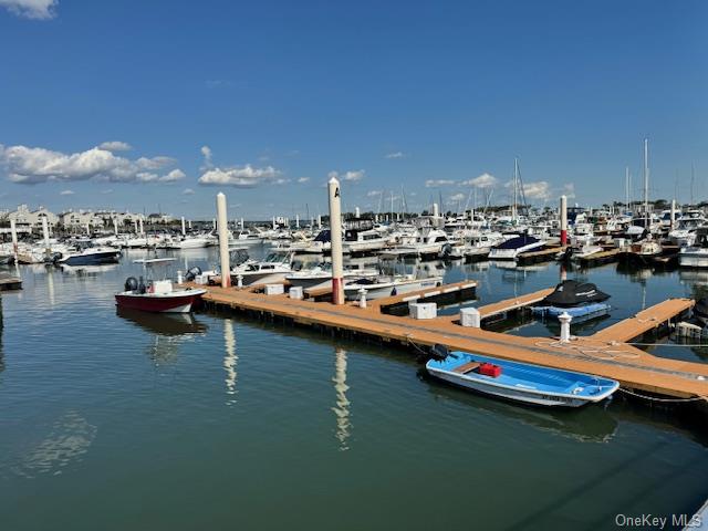 a harbor filled with lots of white furniture and a table