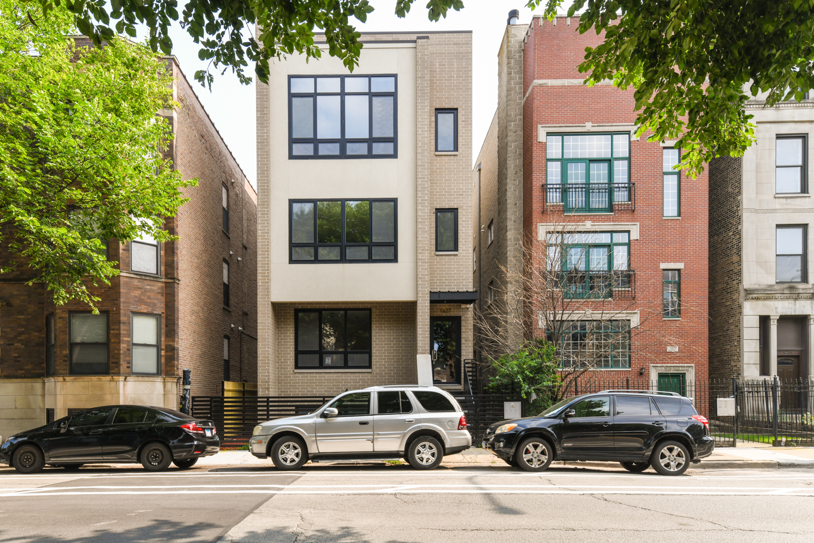 a car parked in front of a brick building