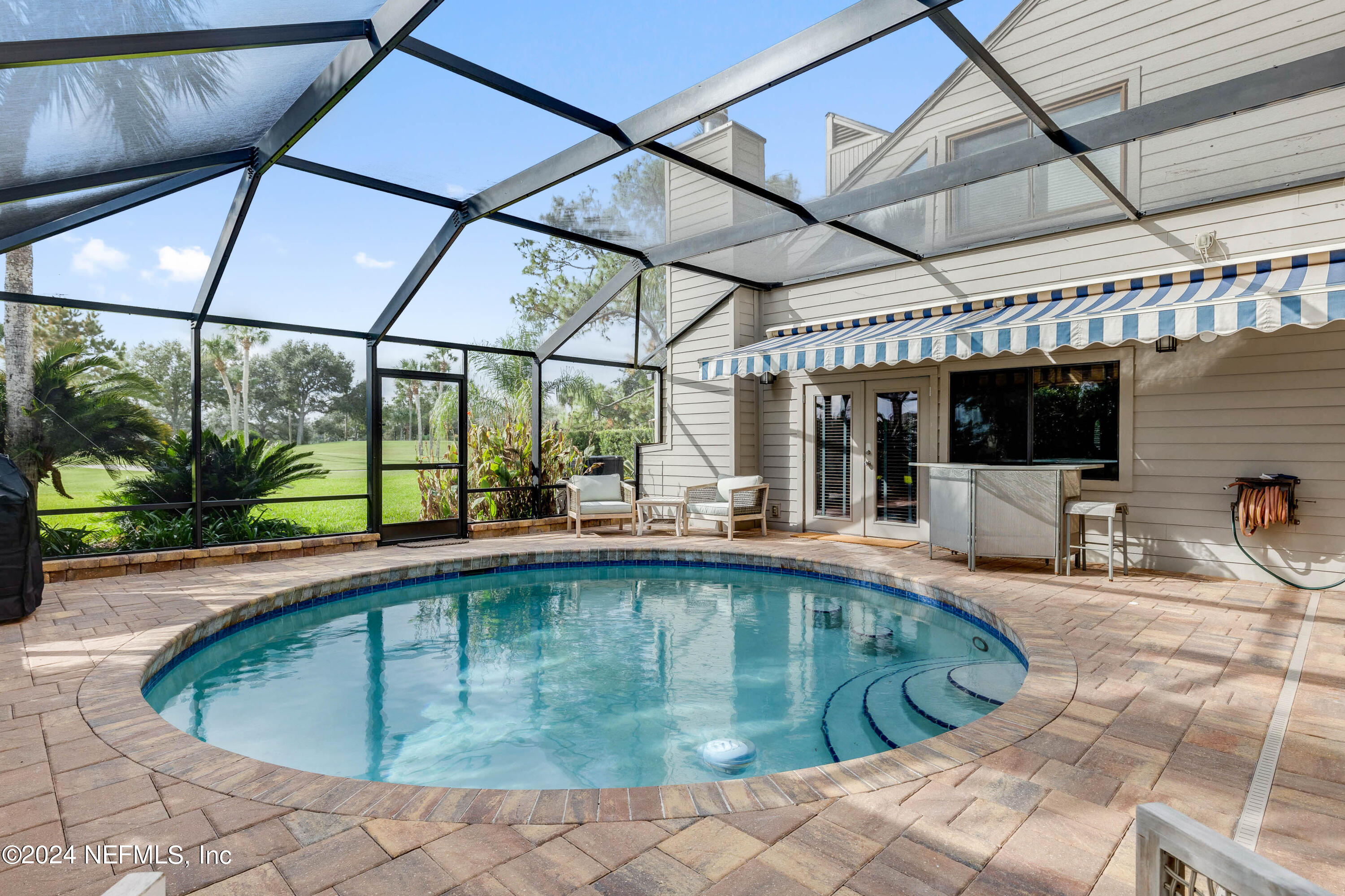 a swimming pool with view of seating