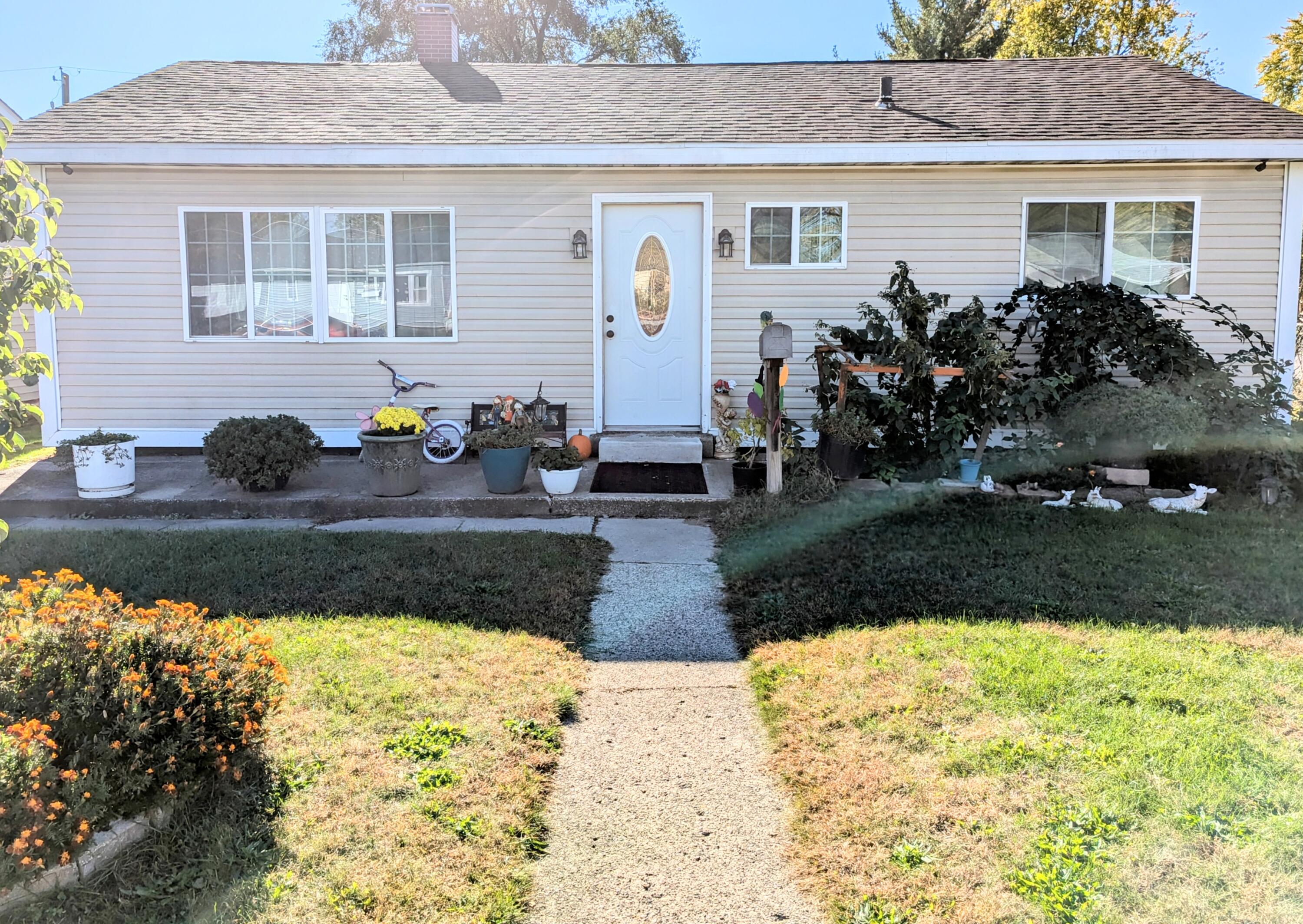 a front view of a house with garden