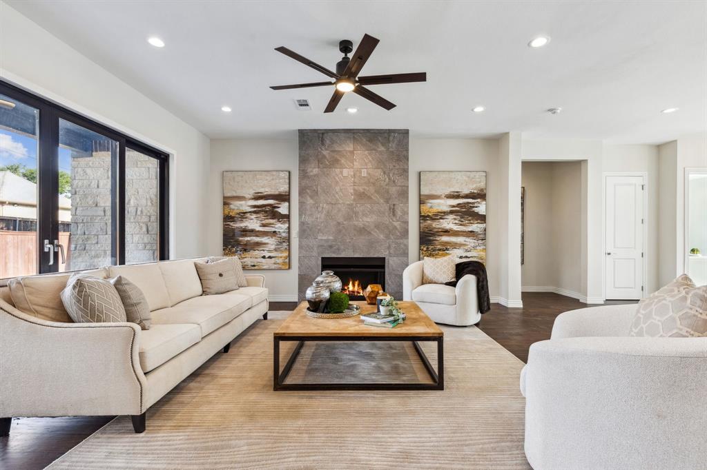 a living room with furniture fireplace and window