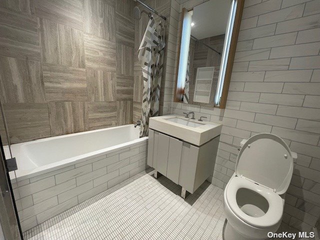 a bathroom with a sink a toilet and bathtub