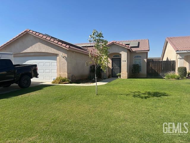 a house that has a big yard in front of it