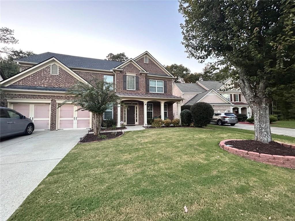 a front view of a house with a yard