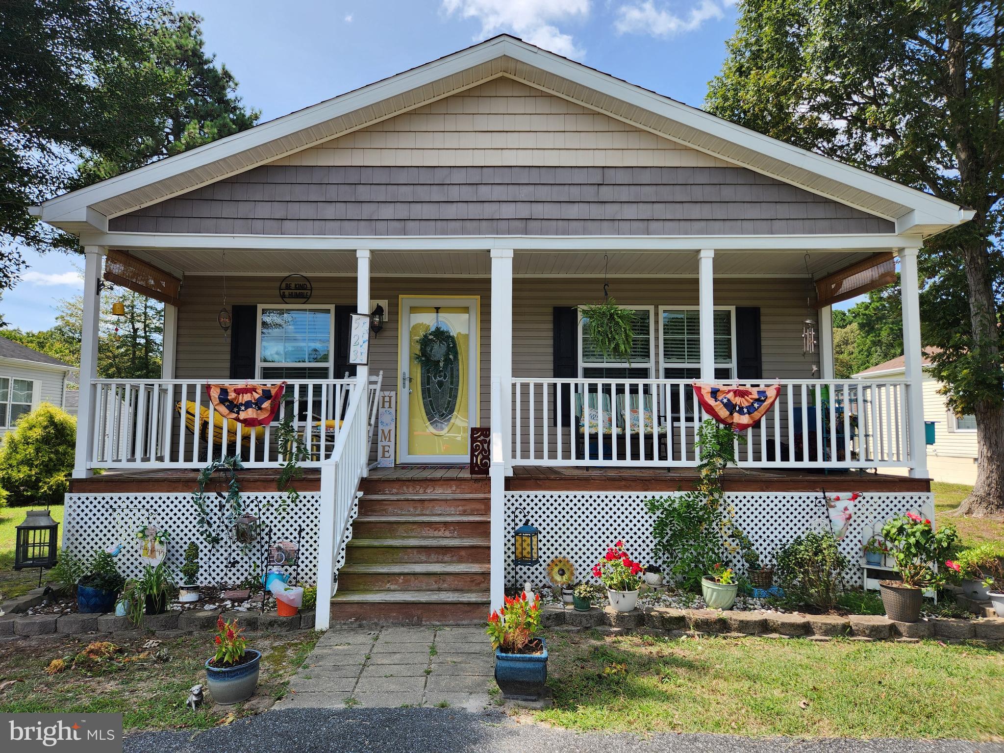 front view of a house with a yard