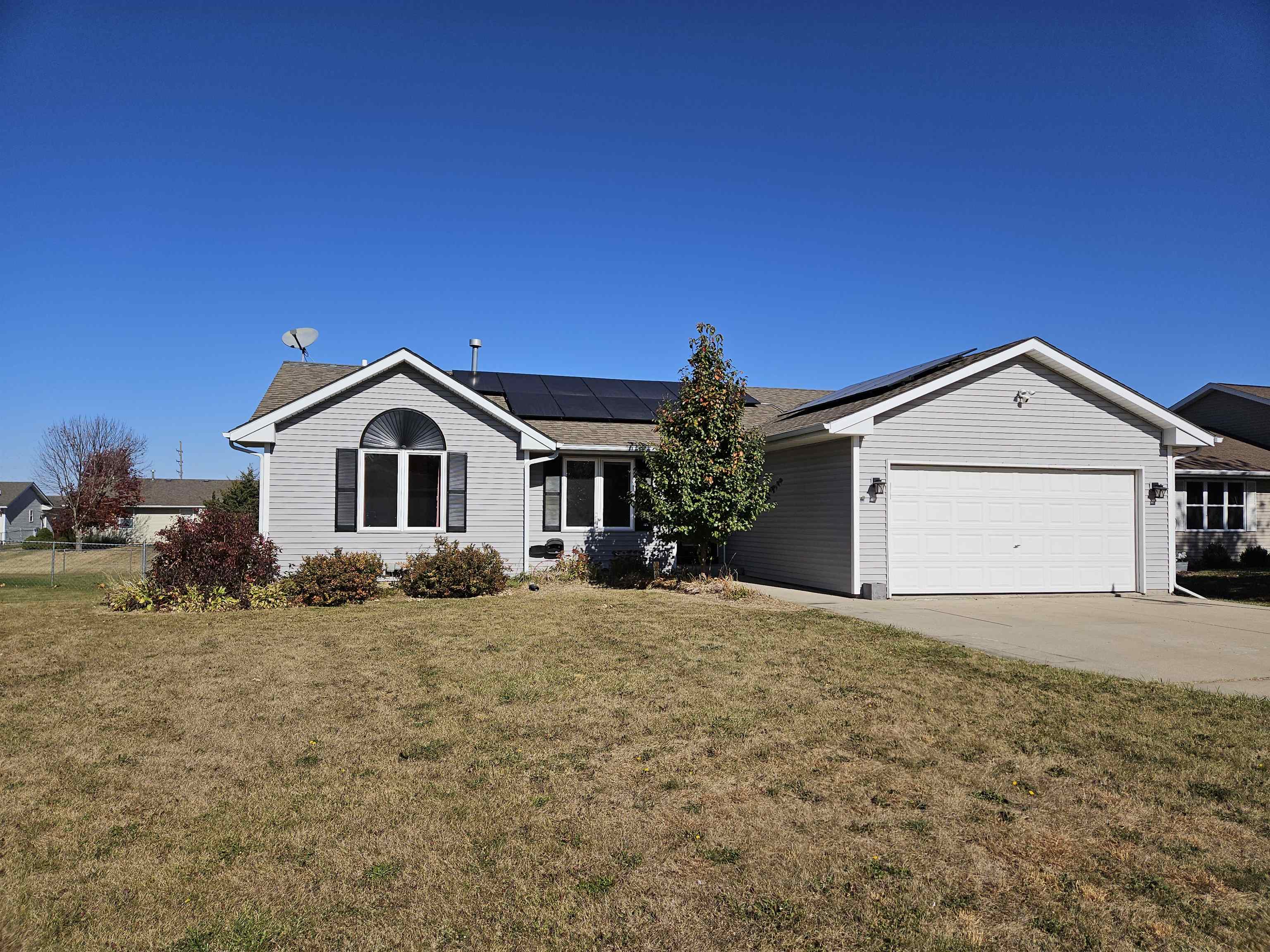 a view of front of house with a yard