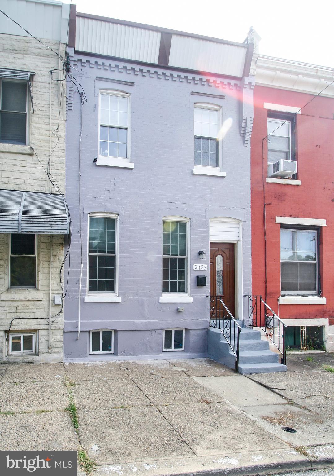 a view of a brick building with many windows