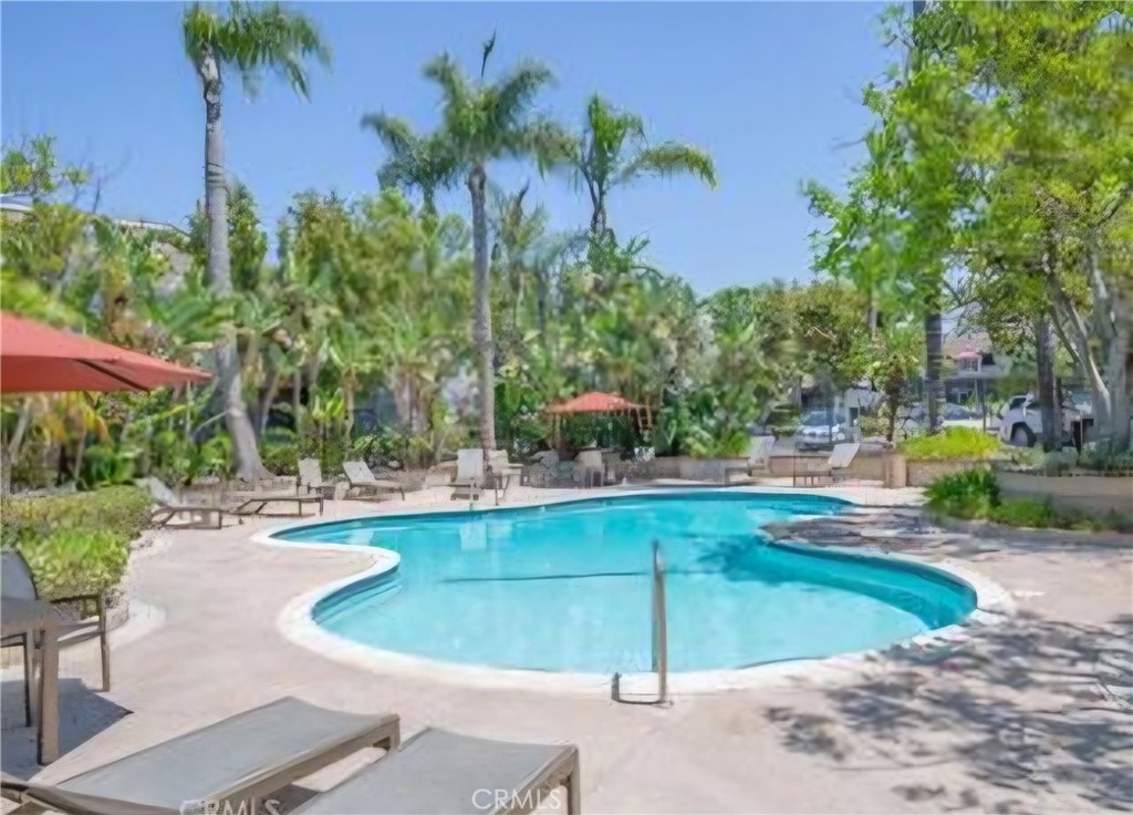 a view of a swimming pool with a patio