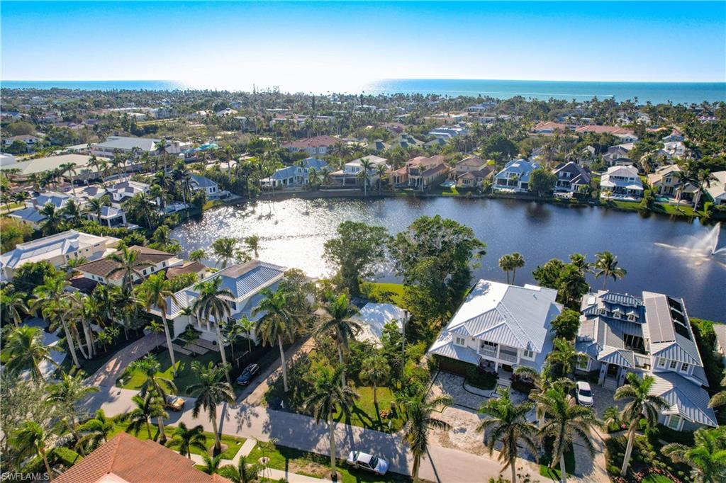 an aerial view of a house with a lake view