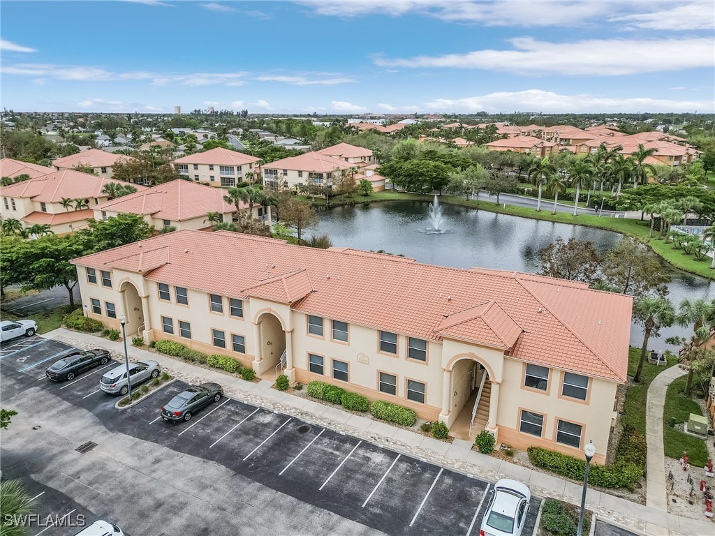 a aerial view of a house with a lake view