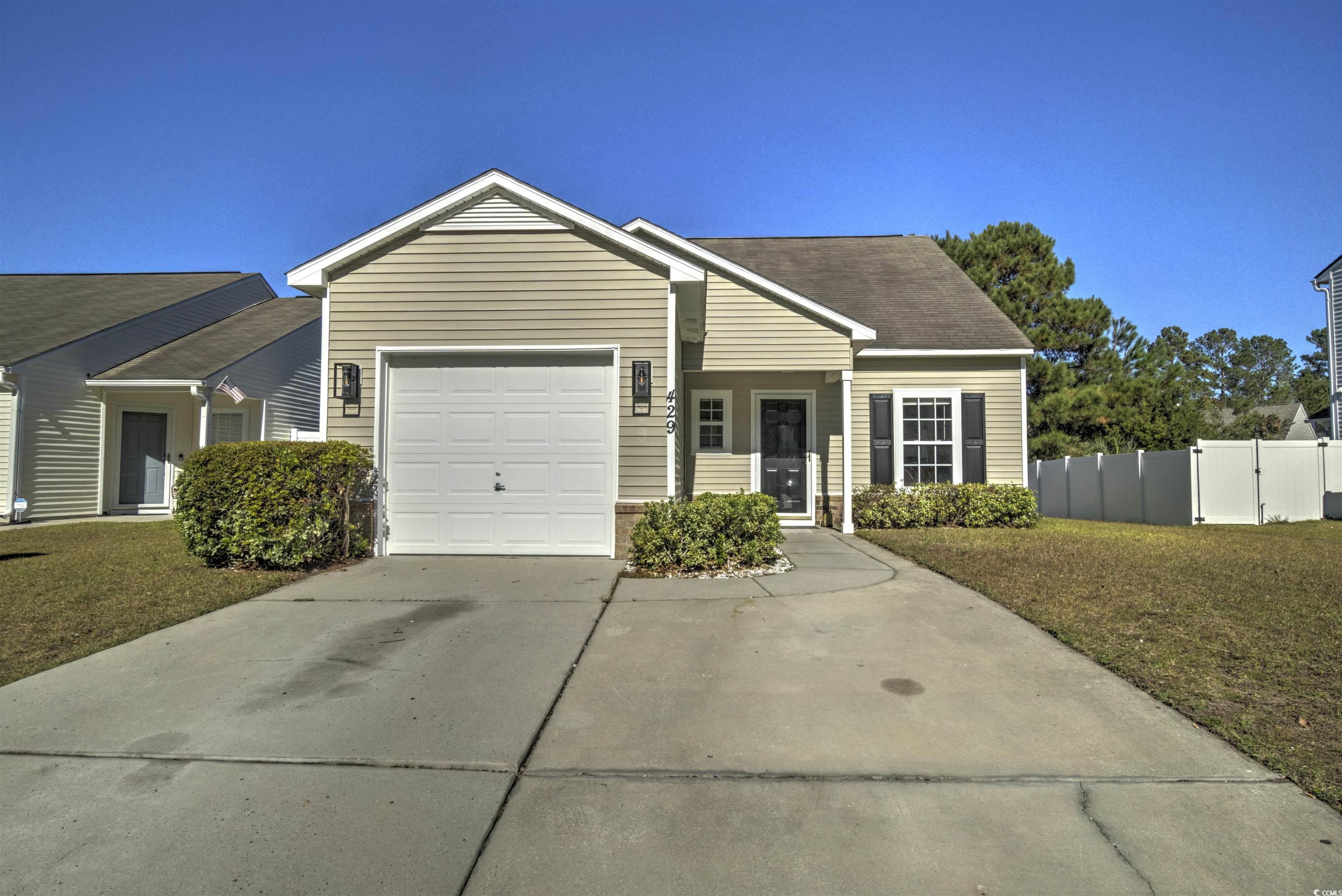 View of front of home featuring a front yard and a