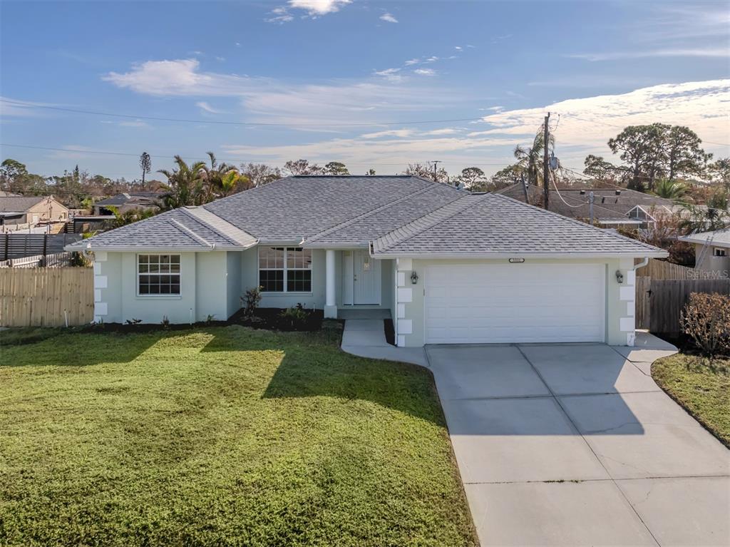 a aerial view of a house with a yard