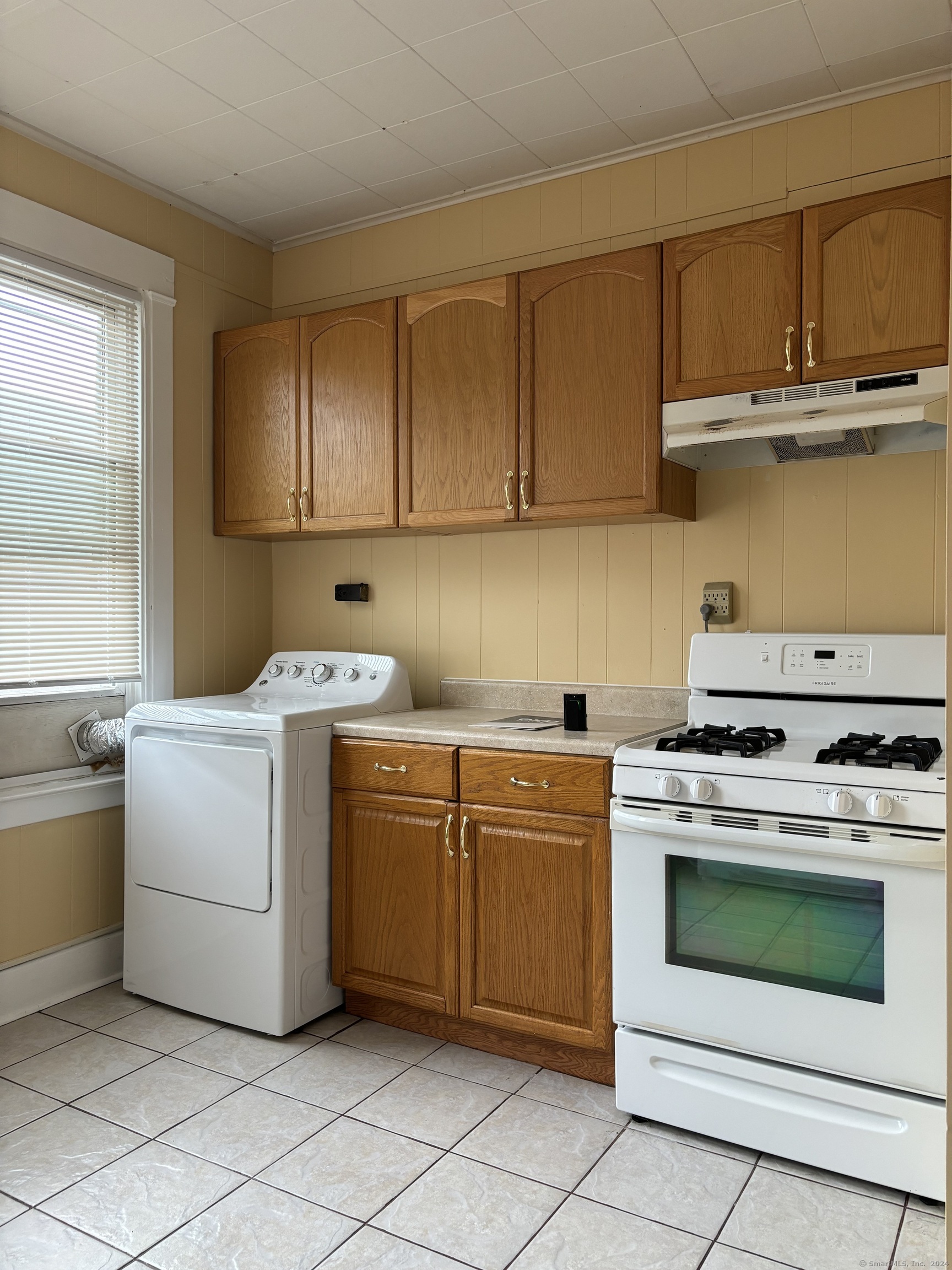 Kitchen with stove, fridge, washer and dryer