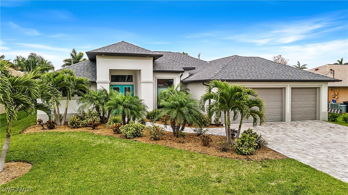 a front view of a house with a garden