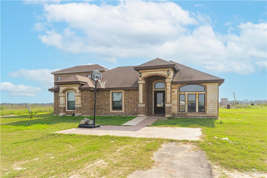 a front view of a house with a yard