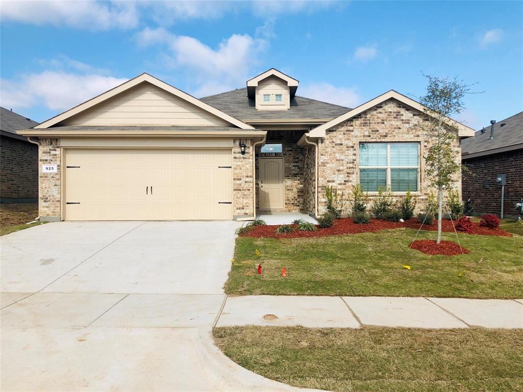 a view of a house with garage and garden