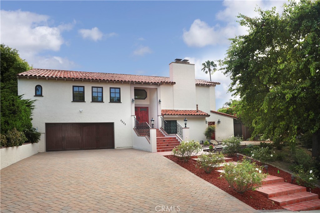 a front view of a house with yard