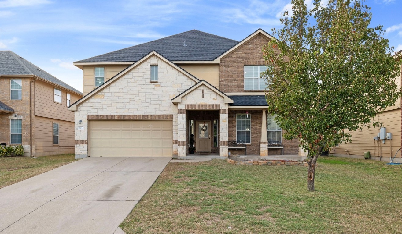 front view of a house with a yard