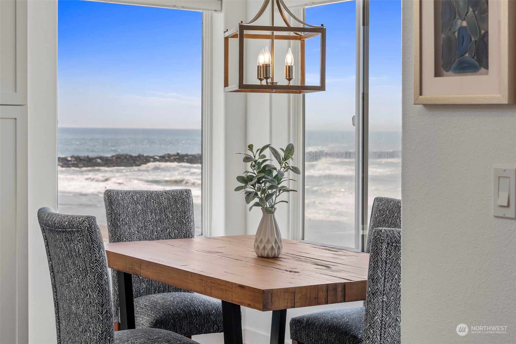 a view of a dining room with furniture and window