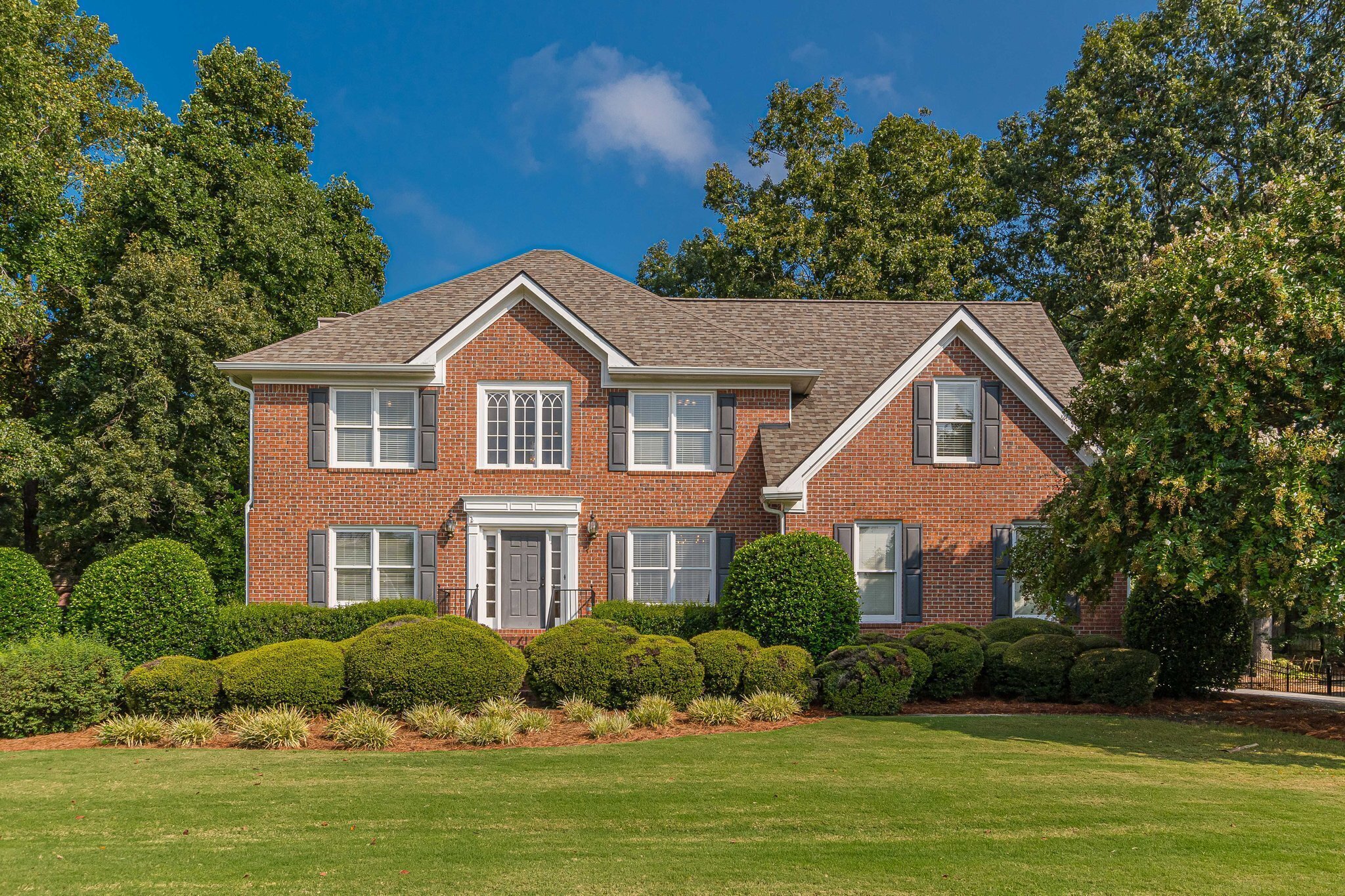 a front view of a house with a yard