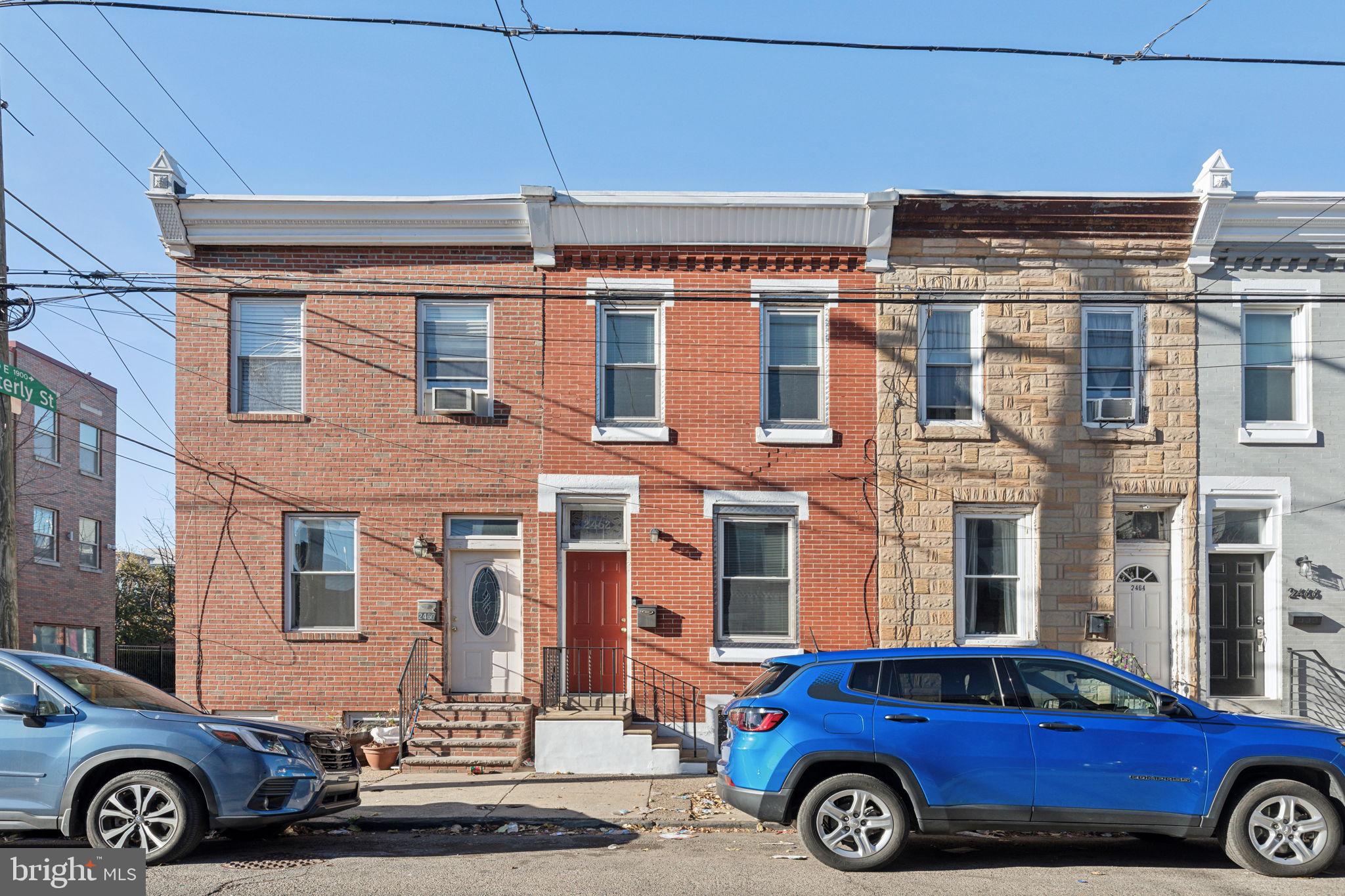 a front view of a house with parking space