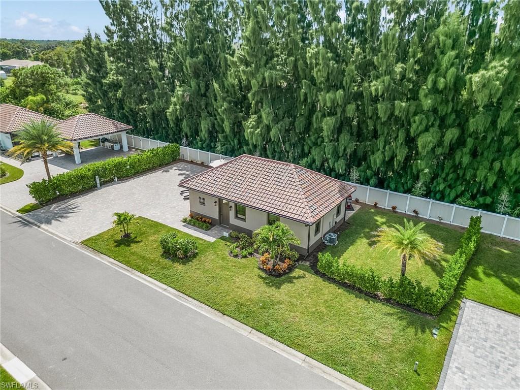 a view of a garden with a house