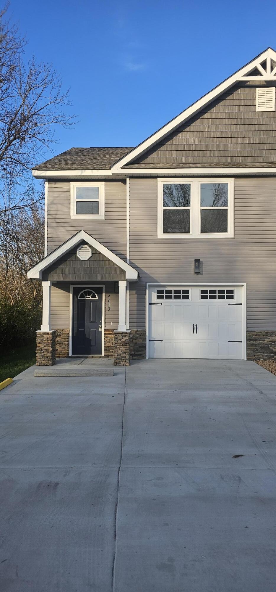 a front view of a house with garage