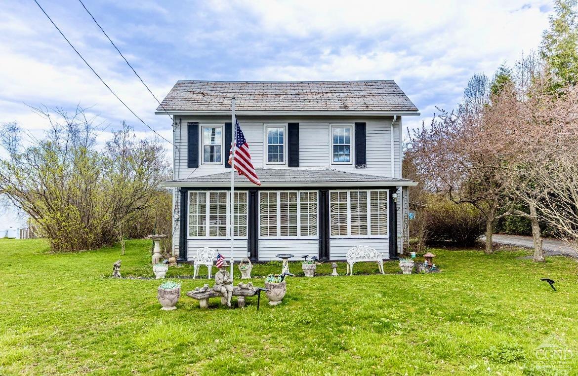 front view of a house with a yard