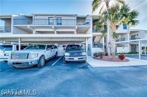 a view of a car park in front of house