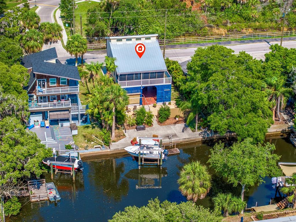 an aerial view of house with yard swimming pool and outdoor seating